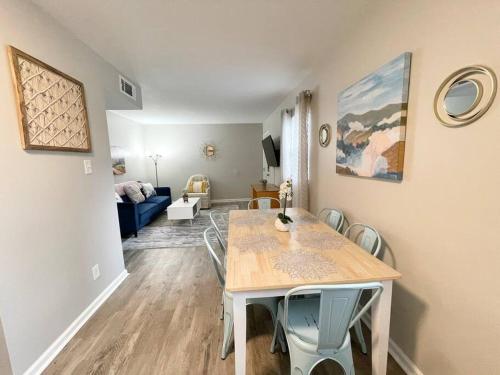 a dining room with a table and chairs in a living room at * Cozy Crib * Pet Friendly * King Bed * in Durham