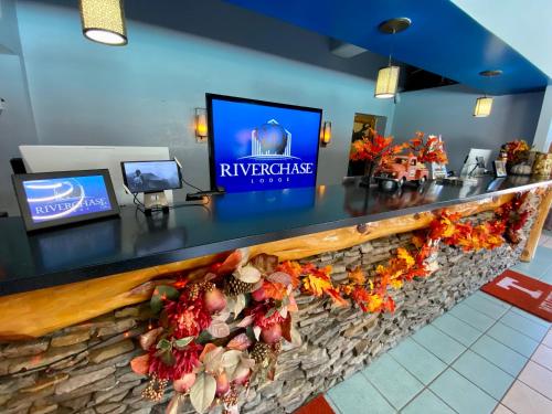 a bar in a restaurant with a stone counter at Riverchase Lodge in Pigeon Forge