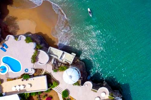 an aerial view of the beach and the ocean at Piergiorgio Palace Hotel in Sosúa