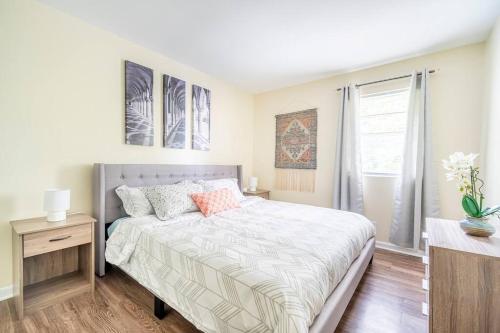 a bedroom with a large bed and a window at *Cool Crib * King Bed * Long Term Stays * Duke* in Durham