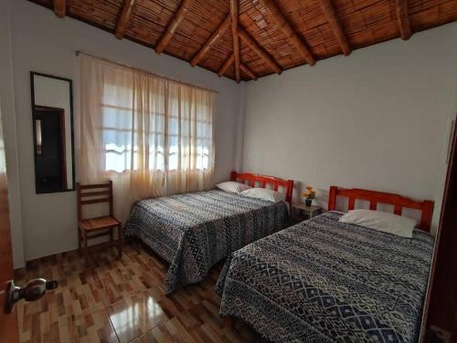 Casa de Campo El Mirador - Lunahuanáにあるベッド