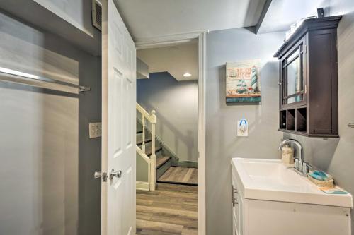 a bathroom with a sink and a staircase at Vibrant Hyattsville Home 7 Mi to Downtown DC! in Hyattsville