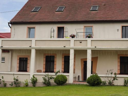 a large white house with a brown roof at Agroturystyka Na górce 