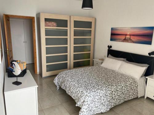 Ένα ή περισσότερα κρεβάτια σε δωμάτιο στο Apartamentos playa chica / playa las gaviotas