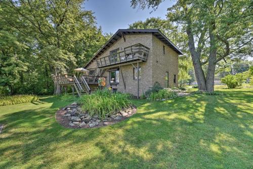 a brick house with a porch on a lawn at Brocton Escape Skiing, Snowtubing, Hiking! in Brocton