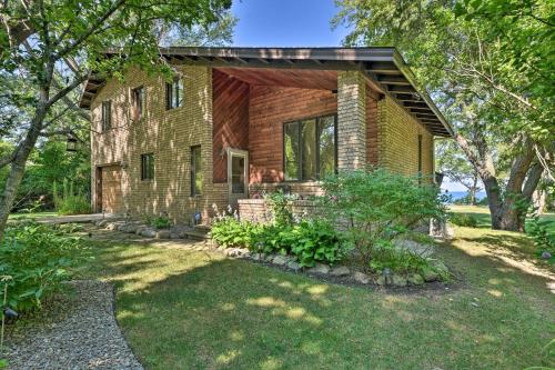 an old brick house with a garden in front of it at Brocton Escape Skiing, Snowtubing, Hiking! in Brocton