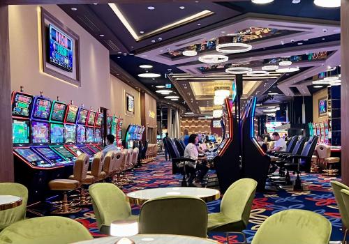a casino with people sitting at the slot machines at My Sunshine Apartments in Batumi in Batumi