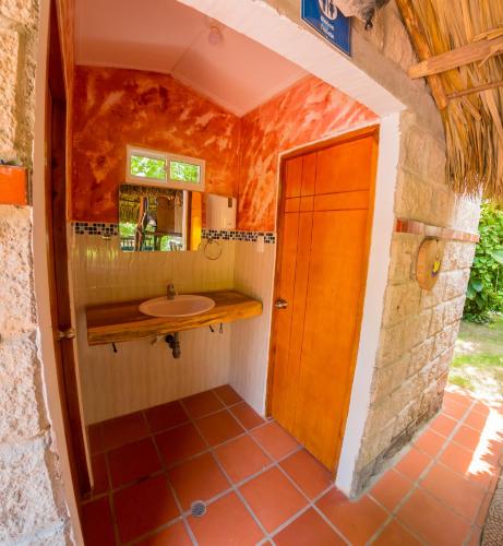 a bathroom with a sink and a mirror at Portoazul Casa de Playa in Puerto Colombia