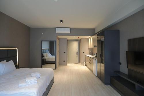a hotel room with a bed and a bathroom at Hotel54 Luxury Suite in Sakarya
