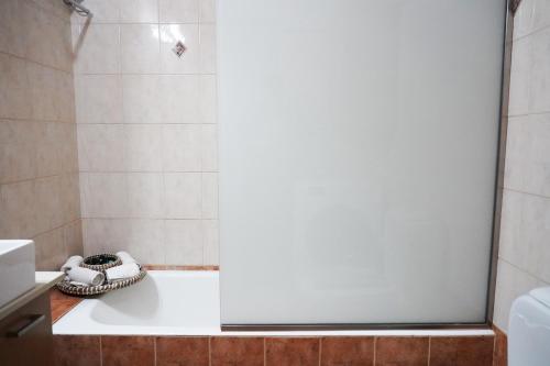 a bathroom with a tub and a shower stall at Villa Tzekos in Kendrokhórion