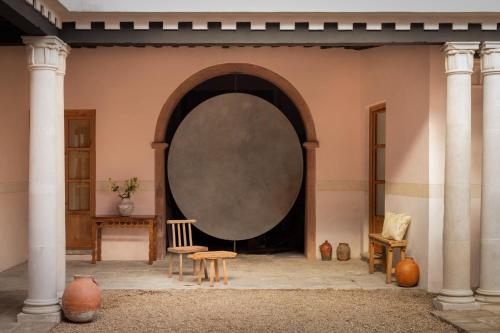 a room with a large mirror on the wall at La Valise San Miguel de Allende in San Miguel de Allende