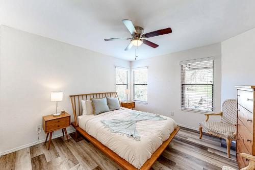 a bedroom with a bed and a ceiling fan at Canyon View #1203 in Tucson