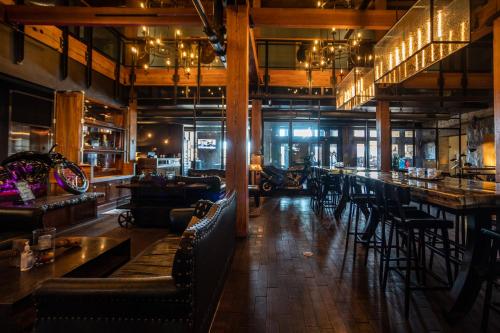 a bar with chairs and tables in a restaurant at The Iron Horse Hotel in Milwaukee