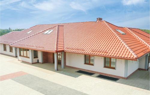 an overhead view of a house with an orange roof at One-Bedroom Apartment In Borcz in Borcz