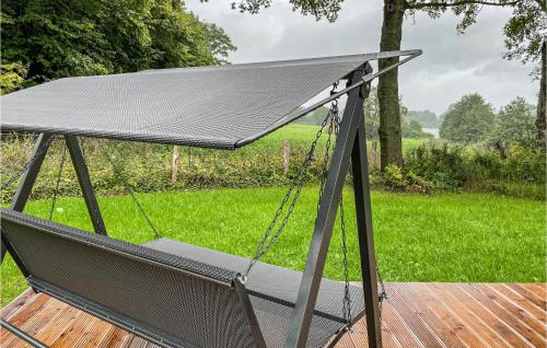 a hammock on a deck with a field of grass at Stunning Home In Krems Iiwarderbrück in Göls