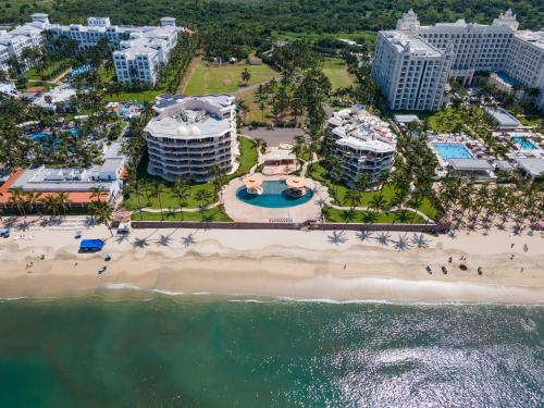 an aerial view of a beach and buildings at Ocean Front Condo with Pool Sleeps 6 Adults-Quinta del Mar 203 in Nuevo Vallarta