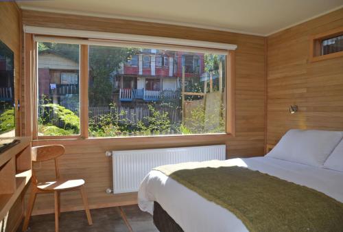 Postelja oz. postelje v sobi nastanitve Palafito Verde Apart Hotel