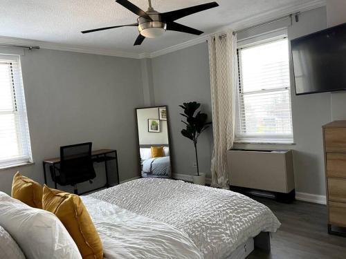 a bedroom with a bed and a ceiling fan at Home Away from Home Condo Downtown ATL 16th floor in Atlanta