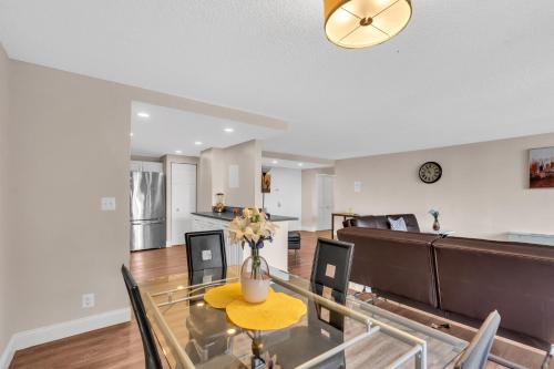 a dining room and living room with a table and chairs at Arlington 2BR 2Ba Apartment in Crystal City apts in Arlington