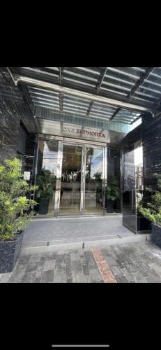 a store front of a building with glass doors at Walking Street Condo Beautiful 1 king bedroom in Angeles