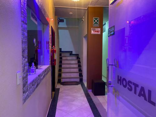 a hallway of a hospital with purple lights at Hostal el Paraíso in Cuenca