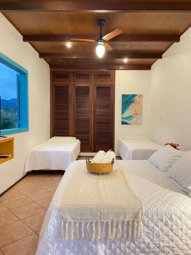 Katil atau katil-katil dalam bilik di Villa Tiê Paraty