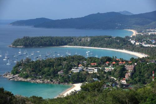a view of a beach with boats in the water at The Green House in Kata Beach