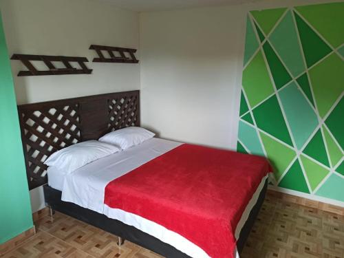 Ein Bett oder Betten in einem Zimmer der Unterkunft Reserva la cascada
