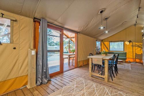 a dining area of a tent with a table and chairs at Ballina Beach Nature Resort in Ballina