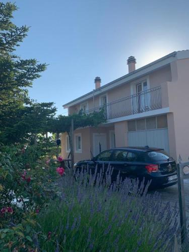 a car parked in front of a house at Apartments with parking space Katuni, Zagora - 18344 in Šestanovac