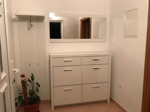 a bathroom with a white dresser and a mirror at Apartments with parking space Katuni, Zagora - 18344 in Šestanovac