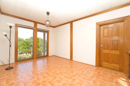 an empty room with a door and a tile floor at Toya Blue in Lake Toya