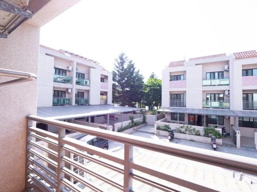 a view of a building from a balcony at Jin Da Paint B&B in Jinning