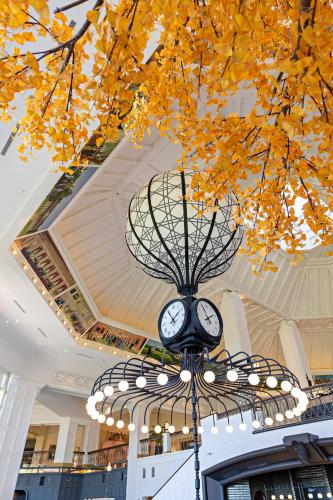 a clock hanging from a chandelier in a building at Hualien Farglory Hotel in Yanliau