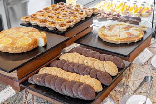 a display case with many different types of cakes and pies at Hualien Farglory Hotel in Yanliau