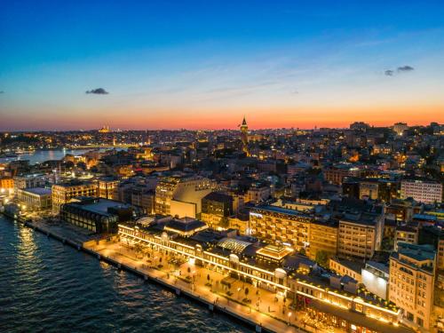 a view of a city at night at Novotel Istanbul Bosphorus Hotel in Istanbul