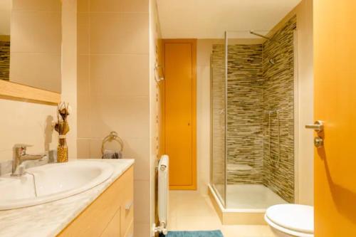 a bathroom with a tub and a sink and a shower at Apt.p/5 15min from Barcelona and Beaches W/Terrace in Sant Adria de Besos