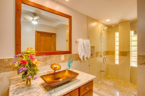 a bathroom with a sink and a shower at Placencia Pointe Townhomes #6 in Placencia Village