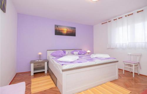 a bedroom with a bed and a table and a chair at Stunning Apartment In Jelsa With 1 Bedrooms And Wifi in Jelsa