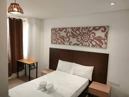 Postel nebo postele na pokoji v ubytování Hotel Rupert A Baler