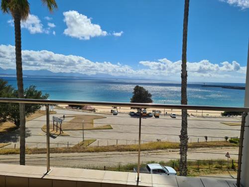 a view of a parking lot and the ocean at Point Village Accommodation - Santos 40 in Mossel Bay