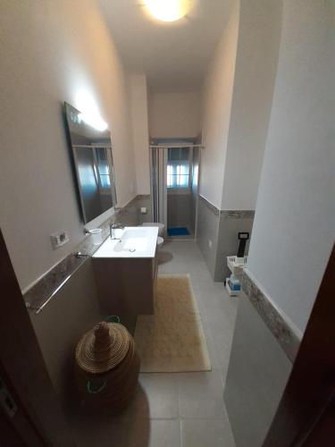 a large bathroom with a sink and a mirror at La mia Dimora in Cocolicchio