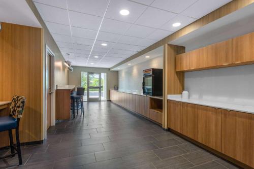 an office hallway with a kitchen and a dining area at Microtel Inn & Suites by Wyndham Amsterdam in Amsterdam