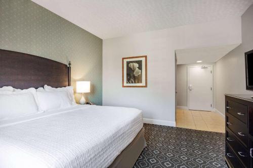 a hotel room with a large bed and a bathroom at Natural Bridge Hotel, Trademark Collection by Wyndham in Natural Bridge