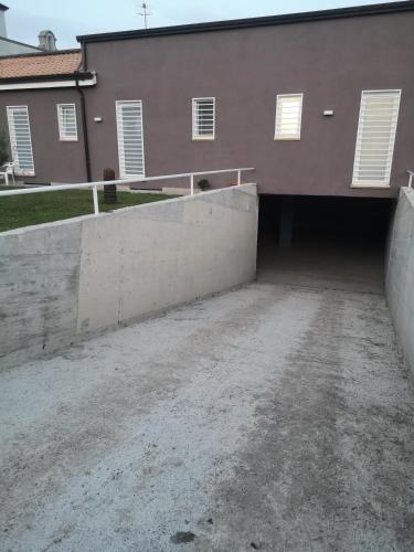 a parking lot in front of a building at B&B Roseal in Brusciano