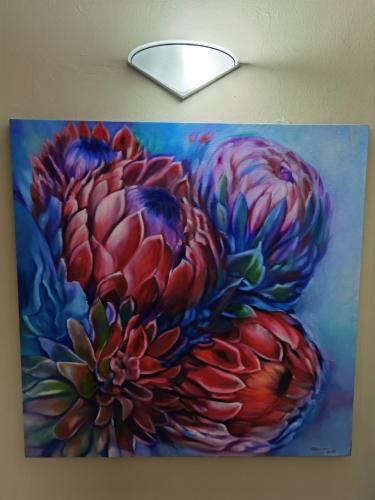 a painting of a bunch of flowers on a ceiling at Misty peaks Cloudlands in Bergview