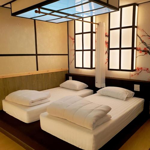Tempat tidur dalam kamar di โรงแรมชิบะรูม นครราชสีมา เซ็นทรัลโคราช