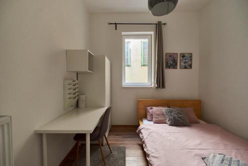 A bed or beds in a room at Dembi at the Great City Park