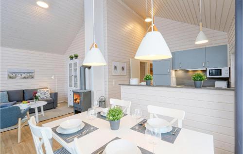 a kitchen and living room with a table and chairs at Gorgeous Home In Krems Iiwarderbrück in Göls