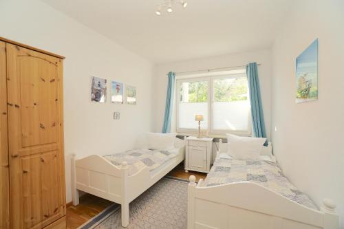 Postel nebo postele na pokoji v ubytování Ferienwohnung Seestern in zentraler Lage von Eckernförde